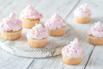 Many pink cream homemade cupcakes