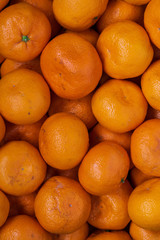 Top view of ripe tangerines background. orange vitamins