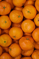 Top view of ripe tangerines background. orange vitamins