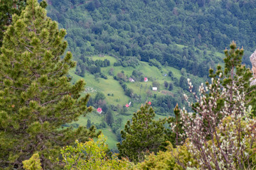 Naklejka na ściany i meble A small village is located on the mountainside.