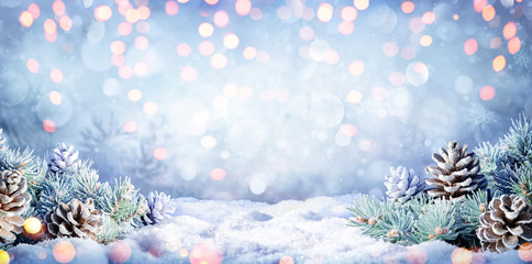 Winter Background With Fir Branches On Snow And Lights

