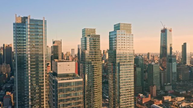Aerial drone footage of New York skyline panning along Hudson Yards midtown Manhattan skyscrapers.