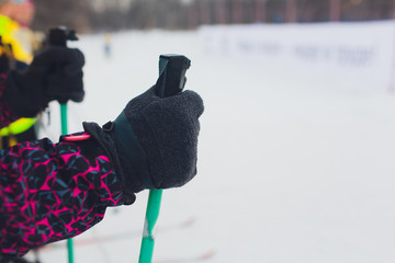 Hand and ski pole with selective focus.