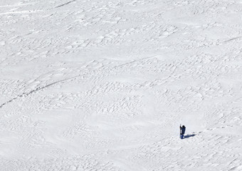 Snowboarder on snowy slope for freeriding at cold winter day