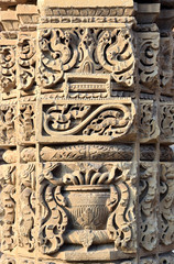 Column with intricate stone carving at the famous Qutub complex an array of monuments and buildings at Mehrauli in Delhi, India