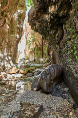 Cyprus. Peyia Avakas gorge. Canyon wall in stone bas-reliefs
