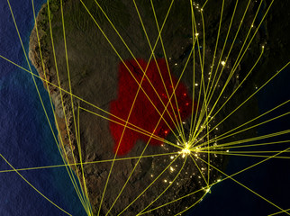 Botswana from space on model of planet Earth with networks. Detailed planet surface with city lights.