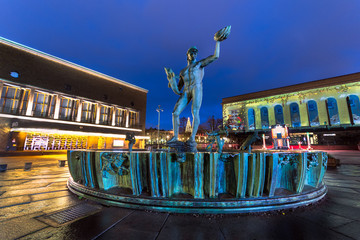 Poseidon statue in the city centre of gothenburg and in the background chritmas decarion at liseburg park