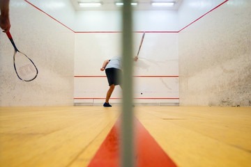 Two friends playing squash in Mutilva, Navarra, Spain