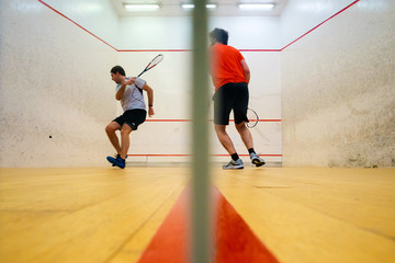 Fototapeta premium Two friends playing squash in Mutilva, Navarra, Spain