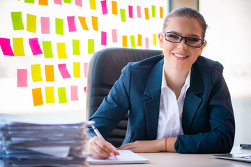Beautiful female employee with many conflicting priorities 