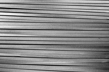 Obraz premium Stack of many metal silver colored plates as background