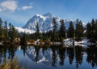 Picture Lake with Mt Shuksan reflecting in the lake is one of the most popular places in Mt Baker Snoqualmie  NF in the Northwest of Washington state. © svetlana57
