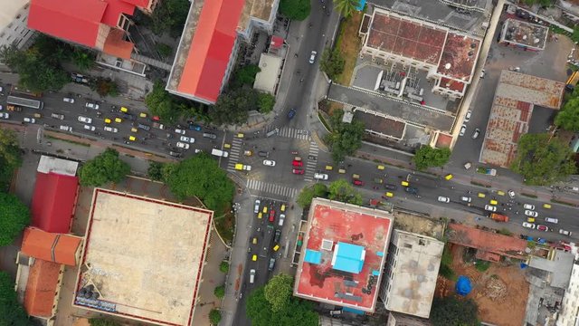 day time bangalore city center traffic street crossroad aerial topdown view 4k india