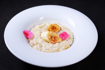 Healthy breakfast. oatmeal porridge with caramelized bananas. Clean eating, vegetarian, vegan, diet food concept