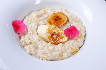 Healthy breakfast. oatmeal porridge with caramelized bananas. Clean eating, vegetarian, vegan, diet food concept