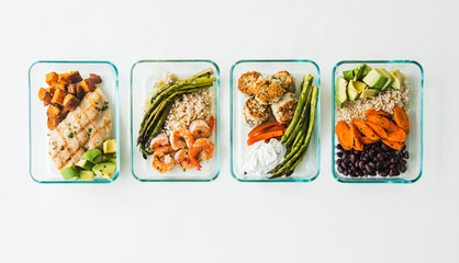 Meal prep containers filled with healthy lunches
