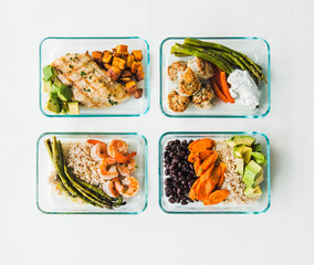 Meal prep containers filled with healthy lunches
