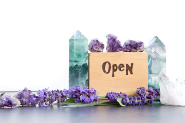 Open sign - word burnt in wood with purple lavender flowers, amethyst, fluorite and quartz crystals...
