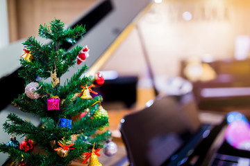 Piano and Christmas tree for christmas holiday background