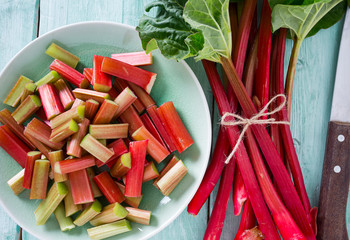 pieces of rhubarb on turquoise wooden surface