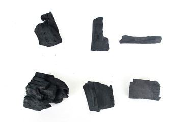 Charcoal burns through high-temperature combustion,Black wood charcoal white background,Charcoal White Background.
