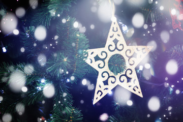 decorations on the Christmas tree,  Christmas tree toys, snowflakes, winter festive background and texture