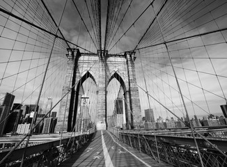 Black and White Picture of the Brooklyn Bridge Upper Walk Deck With Manhattan in the background