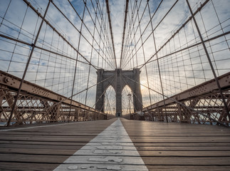 A Low Angle View of the Brooklyn Bridge Upper Walking Deck During Sunrise