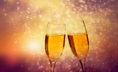 Glasses of champagne against holiday lights