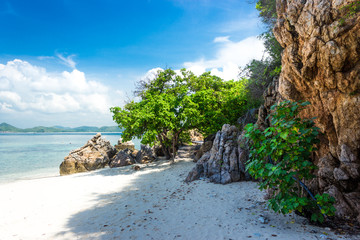 Fototapeta na wymiar Tropical island rock on the beach with blue sky. Koh kham pattaya thailand.