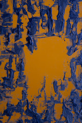 Blue painting on yellow surface