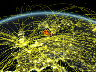 Denmark on planet Earth at night with international network representing communication, travel and connections.