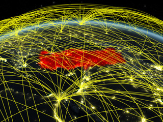 Turkey on planet Earth at night with international network representing communication, travel and connections.