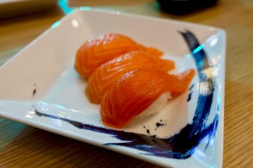 salmon sushi with white plate