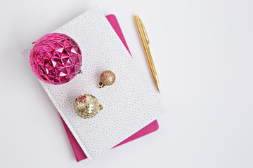 gold and pink notebook with ornament