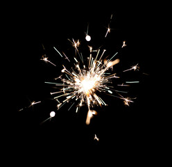 Sparkler Bokeh isolated on black background. Festive Christmas sparkler decoration lighting element. Magic light isolated effect. For the background of the holiday and birthday.