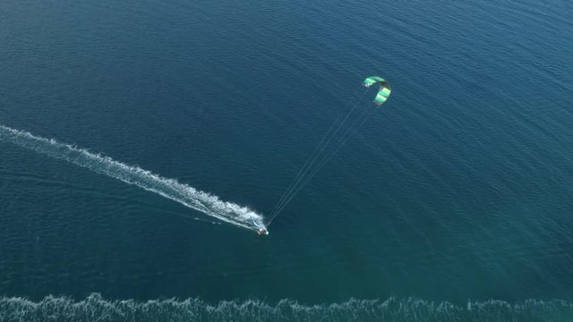 Aerial view of person kitesurfing in the Gulf of Patras, Greece.