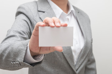 Woman hand holding a business card