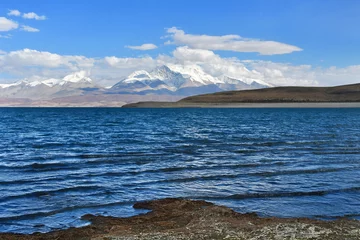 Zelfklevend Fotobehang  Holy Rakshas Tal lake and Gurla Mandhata peak in Ngari, Western Tibet, China. This lake also known as Demons Lake, Ravana Tal or Ravan Harda, Langa Tso in Hindu Religion © irinabal18