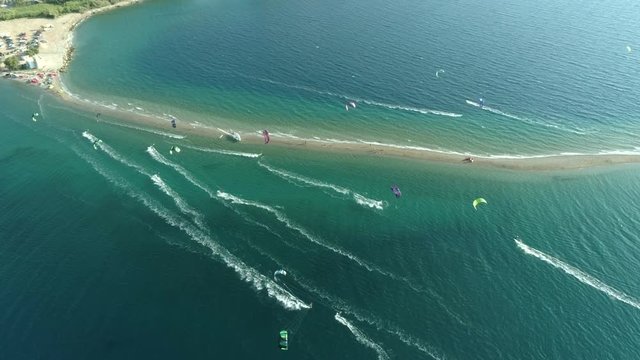 Aerial view of group kitesurfing in the Gulf of Patras, Greece.