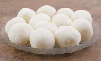 Fototapeta na wymiar Indian Sweet Rasgulla Also Know as Rosogolla, Roshogolla, Rasagola, Ras Gulla, Anguri Rasgulla or Angoori Rasgulla is a Syrupy Dessert Popular in India. It is Made From Ball Shaped Dumplings