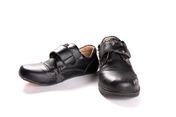 a new leather shoe and a damaged old one on white