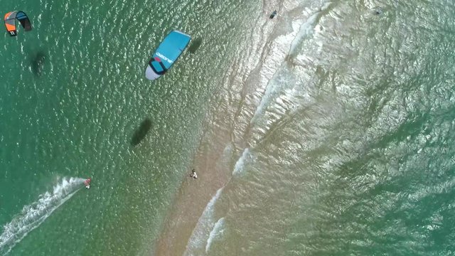 Aerial view of group kitesurfing in the Gulf of Patras, Greece.