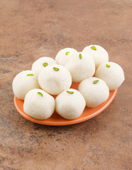 Indian Sweet Rasgulla Also Know as Rosogolla, Roshogolla, Rasagola, Ras Gulla, Anguri Rasgulla or Angoori Rasgulla is a Syrupy Dessert Popular in India. It is Made From Ball Shaped Dumplings