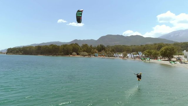 Aerial view of person kitesurfing in the Gulf of Patras, Greece.