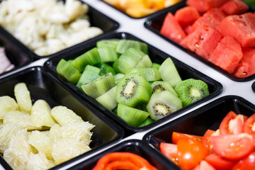 Fresh Vegetables and Fruits sliced in Salad Bar buffet