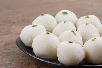 Indian Sweet Rasgulla Also Know as Rosogolla, Roshogolla, Rasagola, Ras Gulla, Anguri Rasgulla or Angoori Rasgulla is a Syrupy Dessert Popular in India. It is Made From Ball Shaped Dumplings