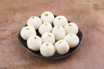 Indian Sweet Rasgulla Also Know as Rosogolla, Roshogolla, Rasagola, Ras Gulla, Anguri Rasgulla or Angoori Rasgulla is a Syrupy Dessert Popular in India. It is Made From Ball Shaped Dumplings