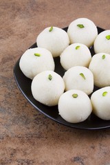 Indian Sweet Rasgulla Also Know as Rosogolla, Roshogolla, Rasagola, Ras Gulla, Anguri Rasgulla or Angoori Rasgulla is a Syrupy Dessert Popular in India. It is Made From Ball Shaped Dumplings
